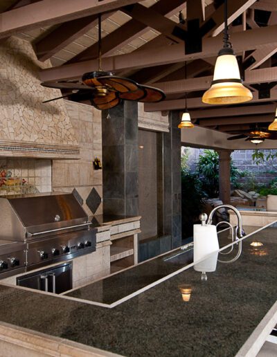 A kitchen with a bar and a grill.